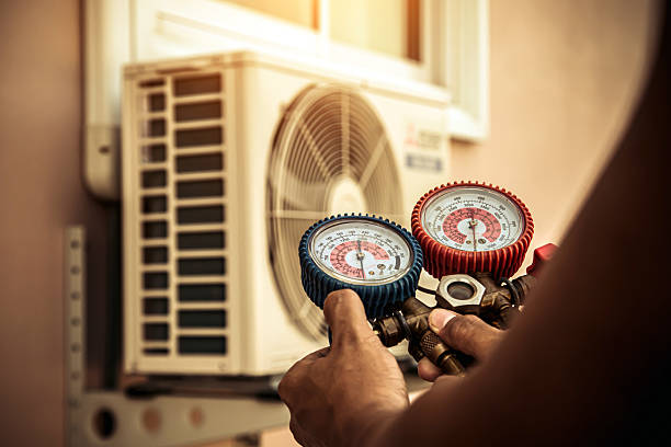 Professional Air Conditioning Service technician working in Vanzant, MO